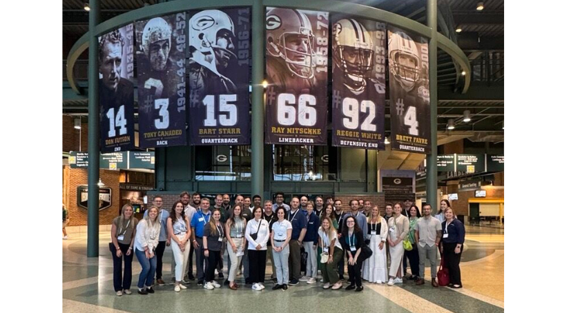 The TLMI group gathering in the Lambeau Field rotunda.